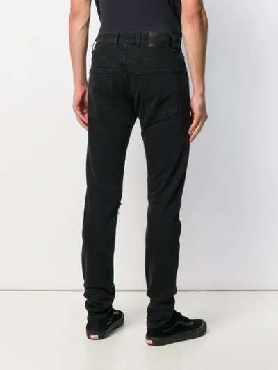 Shop Represent Distressed Denim Jeans In Black