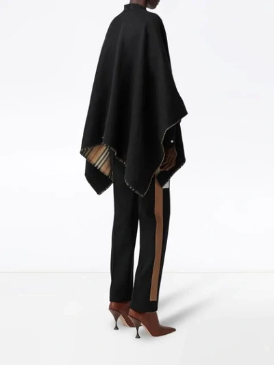 Shop Burberry Icon Stripe Detail Wool Cape In Black