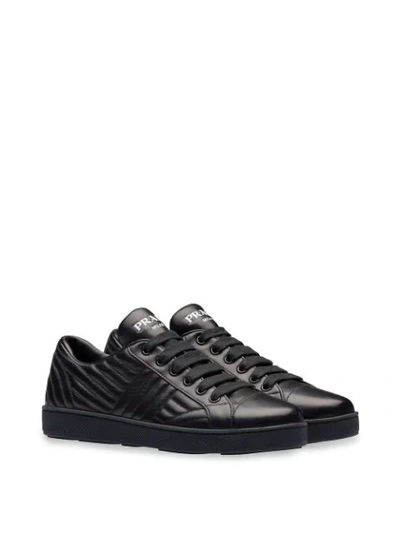 Shop Prada Leather Sneakers In Schwarz