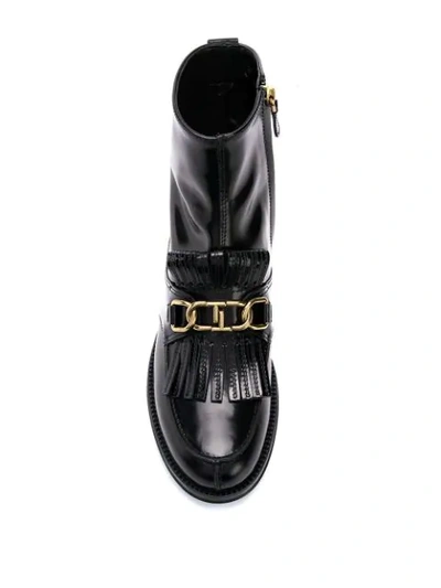 Shop Tod's Fringe Flap Ankle Boots In Black