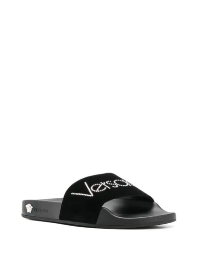 Shop Versace Rhinestone Logo Slide Sandals In Black