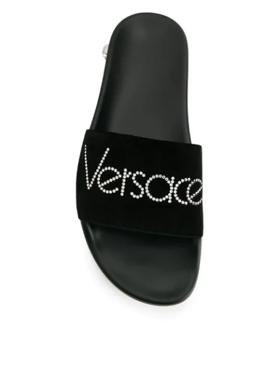 Shop Versace Rhinestone Logo Slide Sandals In Black