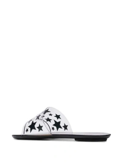 Shop Miu Miu Star Print Flat Sandals In Black