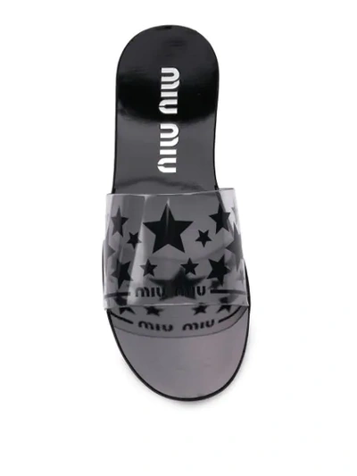 Shop Miu Miu Star Print Flat Sandals In Black