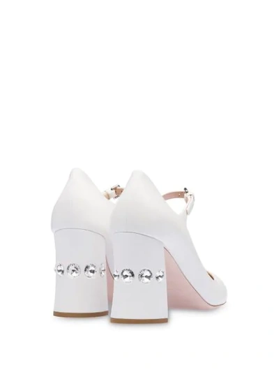 Shop Miu Miu Embellished Slanted Heel Pumps In White