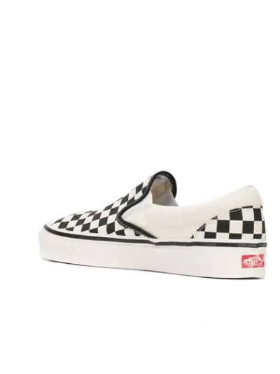 Shop Vans Checked Slip-on Sneakers In White
