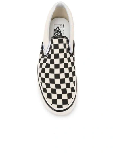 Shop Vans Checked Slip-on Sneakers In White