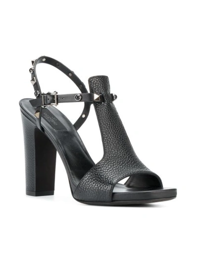 Shop Valentino Garavani Rockstud Rolling Sandals In Black