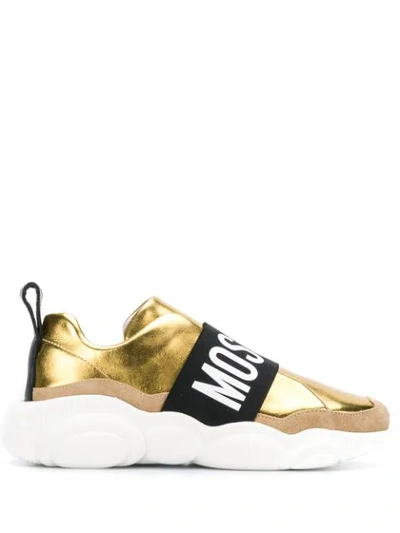 Shop Moschino Contrasting Panel Logo Sneakers In Gold
