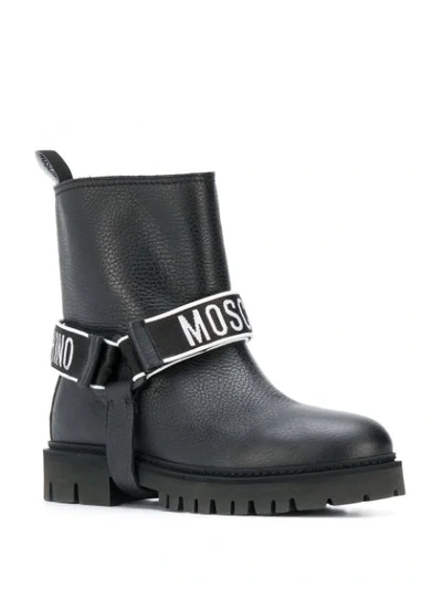 Shop Moschino Logo Strap Boots In 0000