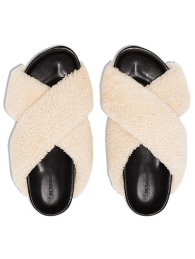 Shop Jil Sander Shearling Cross-over Slides In Black/ White