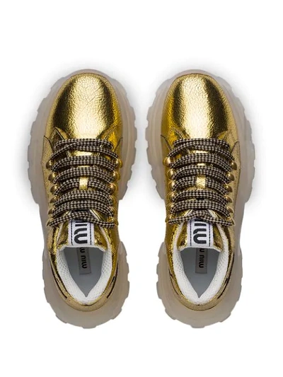 Shop Miu Miu Suede Sneakers In Gold