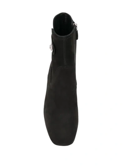 Shop Tod's Side Button Ankle Boots In B999 Black