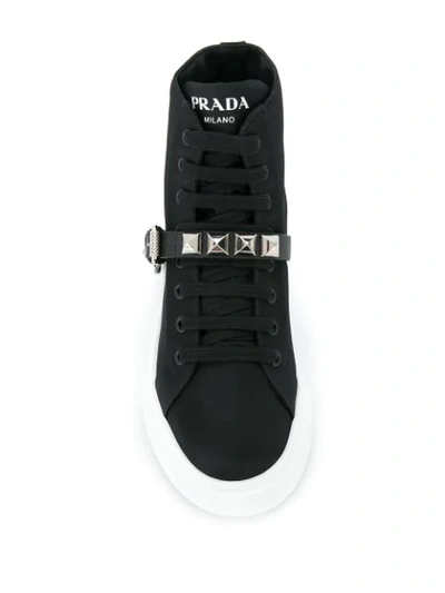 Shop Prada Side Buckled Sneakers In Black
