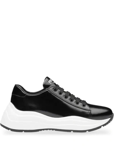 Shop Prada Brushed Leather Sneakers In Black