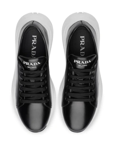 Shop Prada Brushed Leather Sneakers In Black