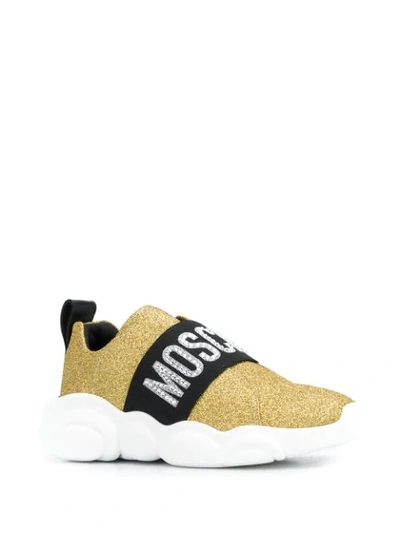 Shop Moschino Logo Glitter Sneakers In Gold