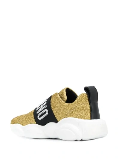 Shop Moschino Logo Glitter Sneakers In Gold