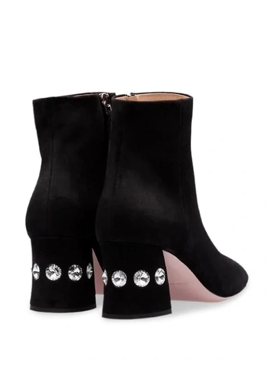 Shop Miu Miu Crystal Embellished Ankle Boots In Black