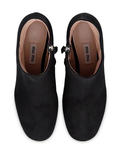 Shop Miu Miu Crystal Embellished Ankle Boots In Black
