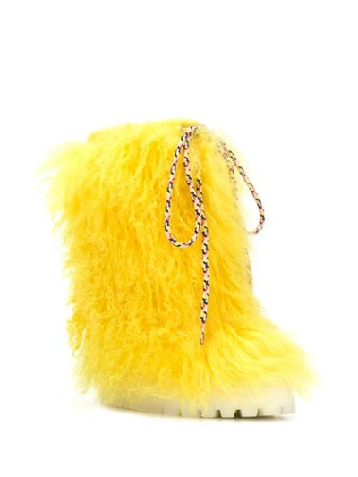 Shop Casadei Fur Snow Boots In Yellow