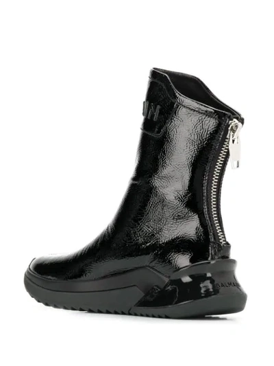 Shop Balmain Logo Embossed Ankle Boots In Black