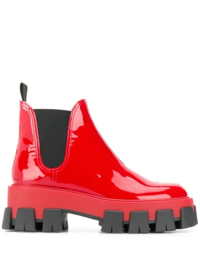 Shop Prada Oversized Ridged Sole Chelsea Boots In Red