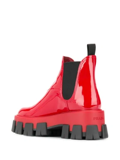 Shop Prada Oversized Ridged Sole Chelsea Boots In Red