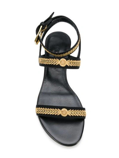 Shop Versace Flat Embroidered Sandals - Black