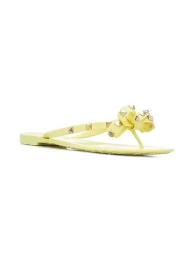 Shop Valentino Rockstud Bow Flip Flops In Yellow