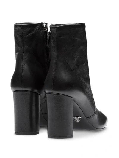Shop Prada Pointed Toe Ankle Boots In Black