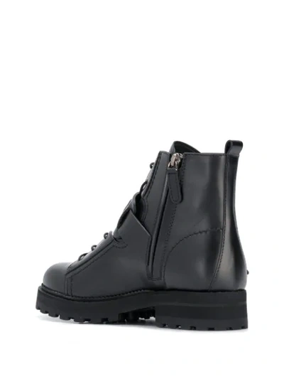 Shop Tod's Buckled Strap Boots In Black