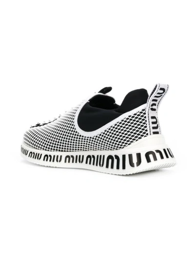 Shop Miu Miu Embellished Sneakers - White