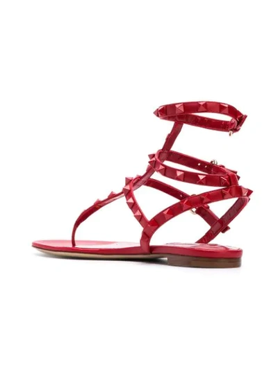 Shop Valentino Garavani Rockstud Flat Sandals - Red
