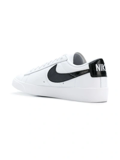 Shop Nike Logo Lace-up Sneakers In White