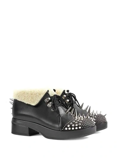 Shop Gucci Studded Ankle Boots In Black
