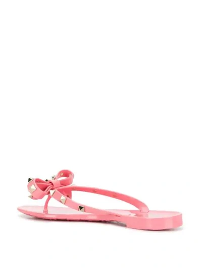 Shop Valentino Garavani Rockstud Bow Flip Flops In Hd8 Pink