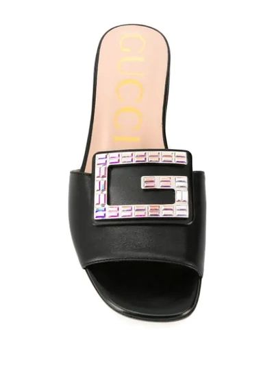 Shop Gucci Embellished G Flat Sandals In Black