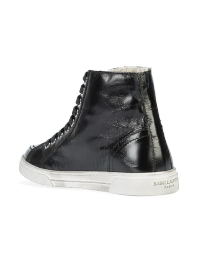 Shop Saint Laurent Hi-top Embossed Sneakers - Black