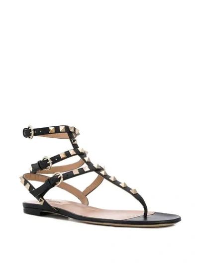 Shop Valentino Garavani Rockstud Thong Sandals In Black