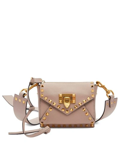 Shop Valentino Rockstud Hype Leather Cross-body Bag In Pink