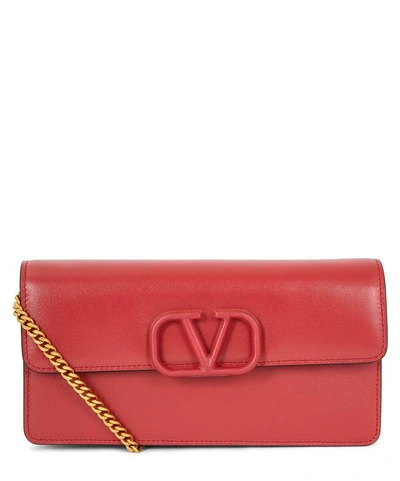 Shop Valentino V-sling Leather Clutch Bag In Rock Pink