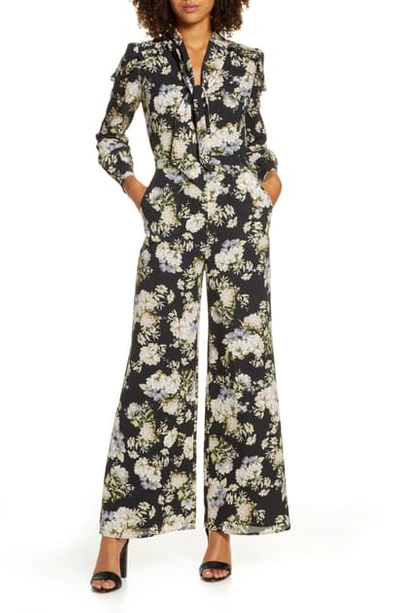 Shop Ali & Jay Stay Magical Floral Print Long Sleeve Jumpsuit In Black Floral