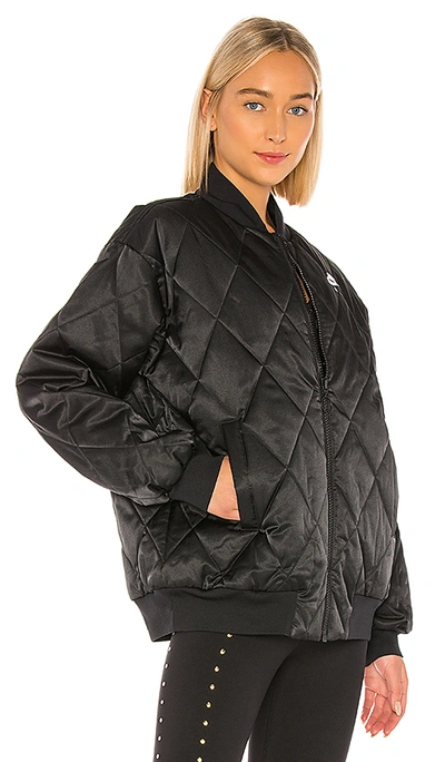 Shop Nike Nsw Air Synthetic Fill Satin Jacket In Black & Pumice