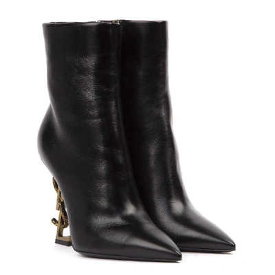 Shop Saint Laurent Pyum Leather Ankle Boots With Bronze Snake Heel In Black