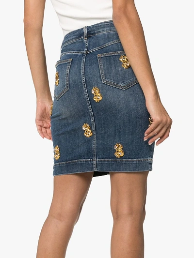 Shop Moschino Dollar Appliqué Denim Skirt In Blue