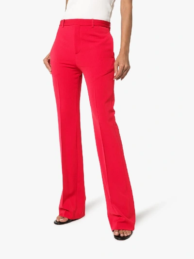 Shop Balenciaga Mid-rise Kick Flare Trousers In Red