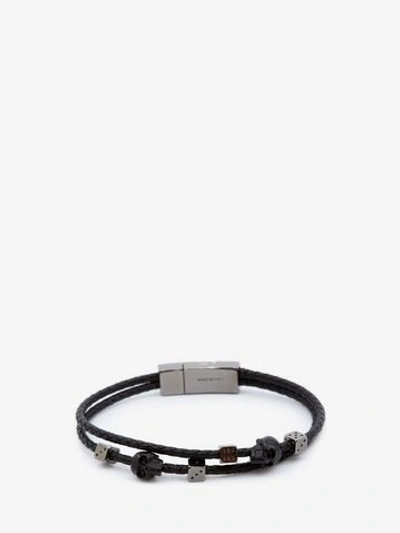 Shop Alexander Mcqueen Skull Braided Leather Bracelet In Black