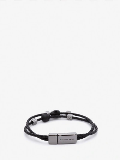 Shop Alexander Mcqueen Skull Braided Leather Bracelet In Black