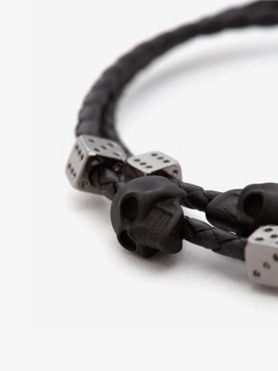 Shop Alexander Mcqueen Skull Braided Leather Bracelet In Black